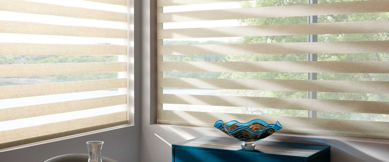 Corner windows covered with Designer Banded shades.